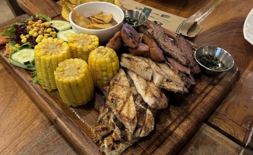 Delicious Costa Rican grilled meats and fresh corn on the cob. Perfect for authentic Tamarindo dining.