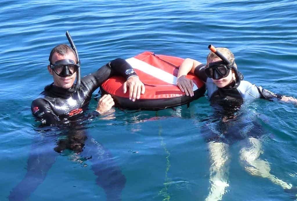 Snorkeling in Tamarindo Costa Rica with scuba gear and life jackets.
