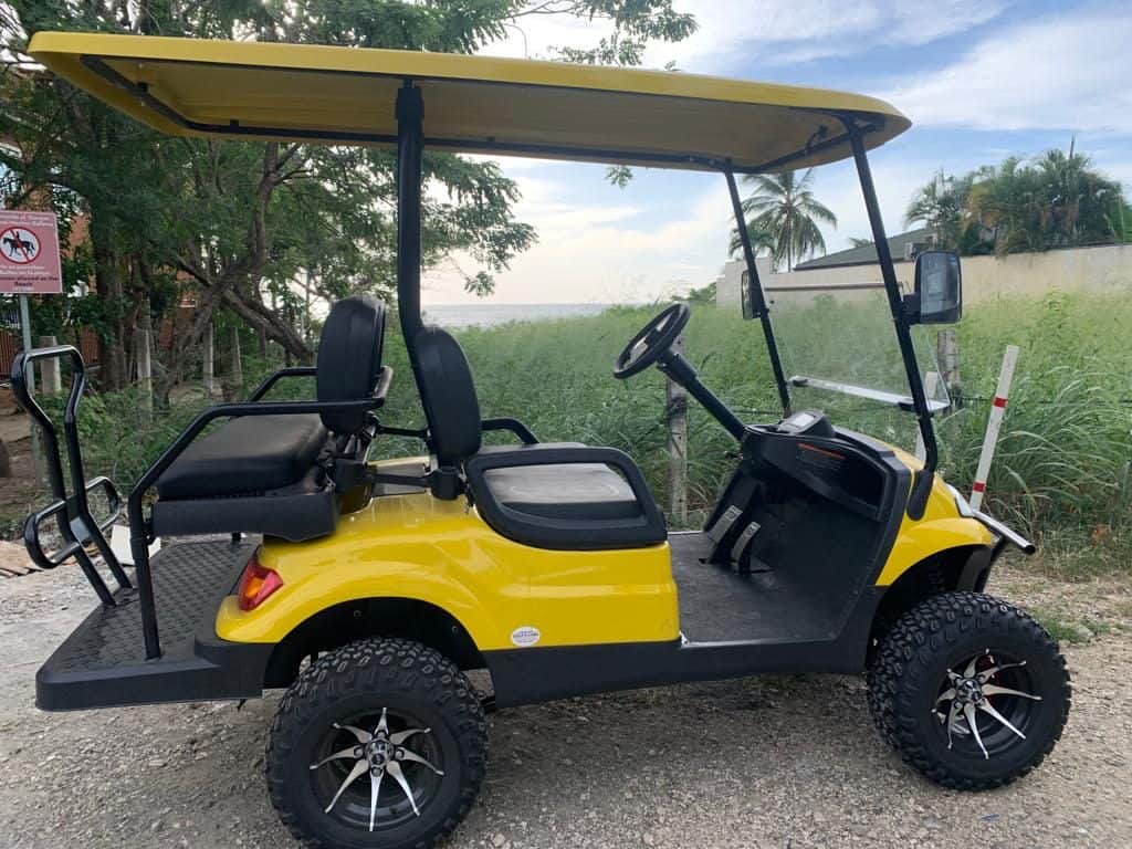 Golf cart rental Tamarindo beach, Costa Rica, leisure vehicle, scenic transportation, vacation activity, outdoor fun, travel convenience.