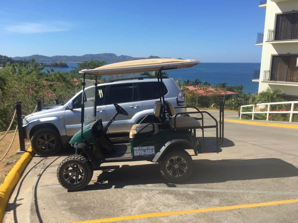 Golf cart with ocean view in Tamarindo, Costa Rica.