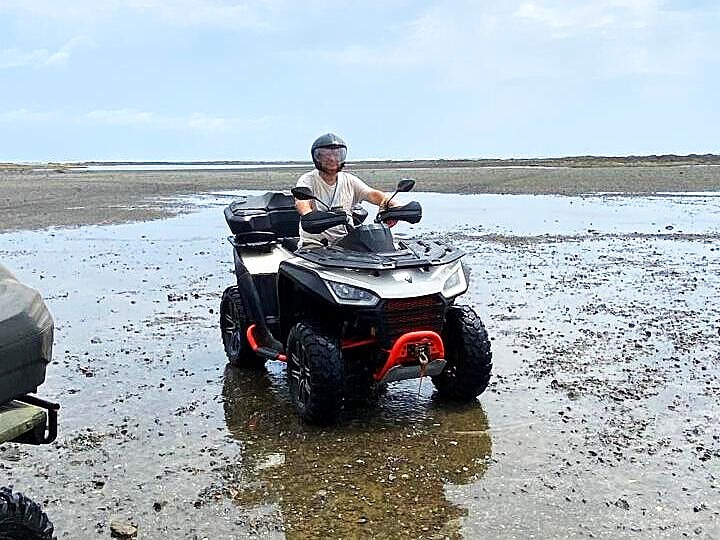 atv parked on tidal flats