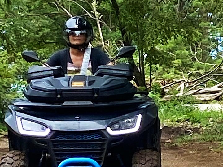 rider on atv forest trail