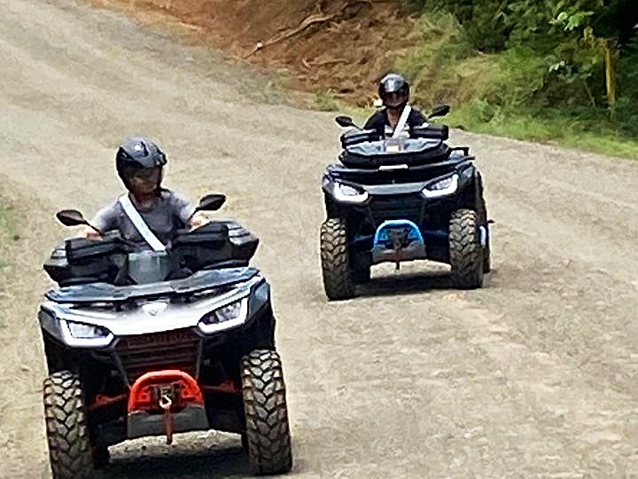 two riders on dirt road