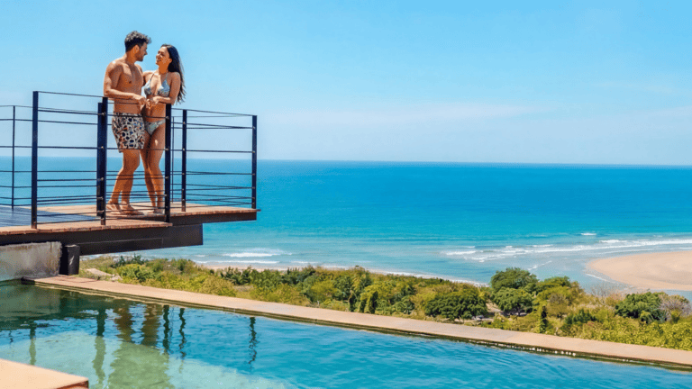 Villagio Musca Tamarindo couple on balcony near pool 003 header image 768x432