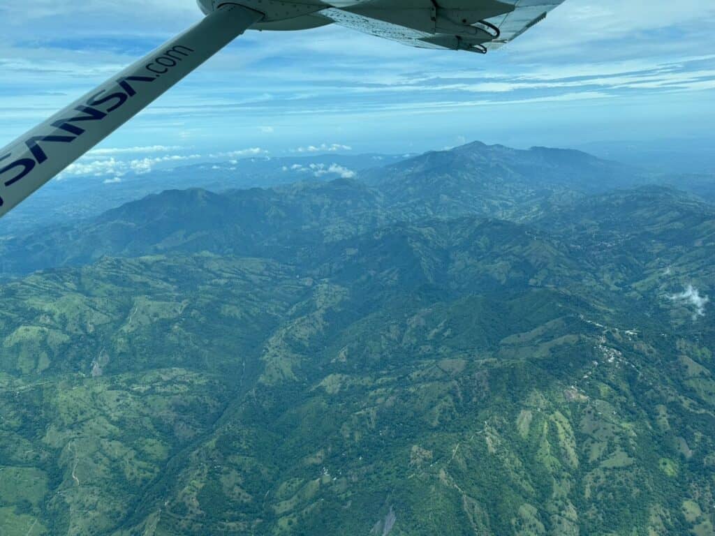 Green mountains of Costa Rica seen from a Sansa plane window