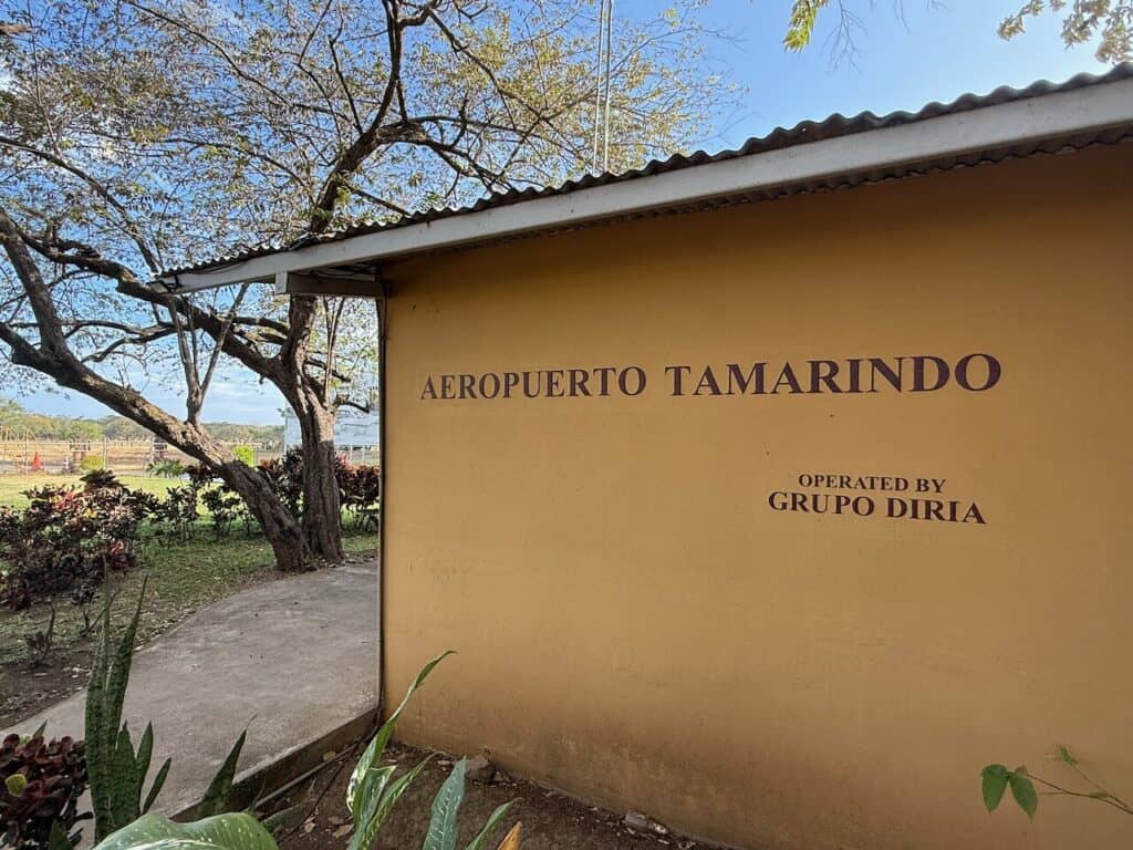 Aeropuerto Tamarindo sign on the wall of the Tamarindo airstrip terminal
