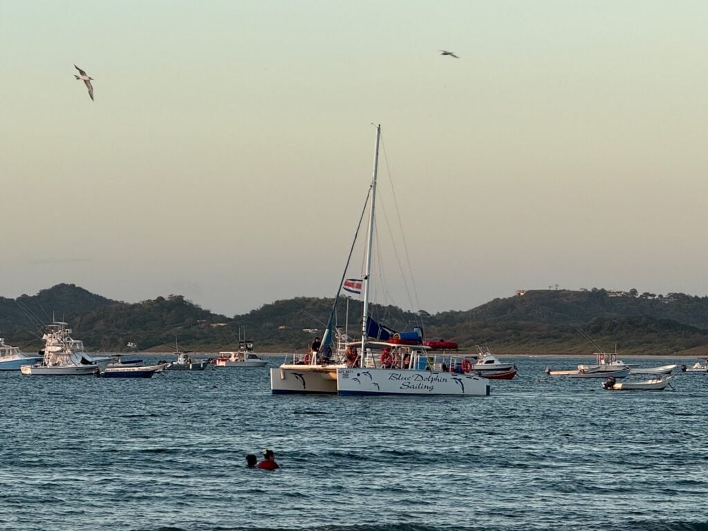 Catamaran in Tamarindo Bay with swimmers in the water