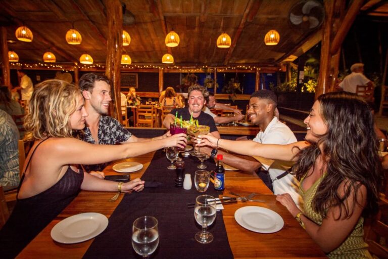 dragonfly bar grill friends toasting at dinner 1 768x512
