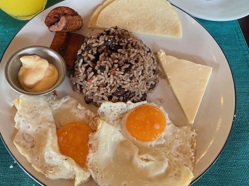 Gallo pinto breakfast with fried eggs, plantains, cheese and sour cream
